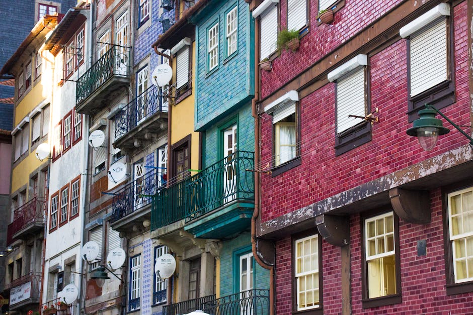 Image of a picturesque street in Portugal with traditional buildings and colorful tiled facades