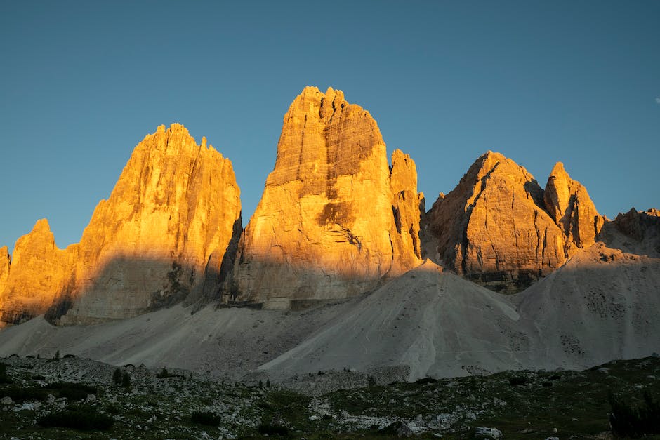 Image of the beautiful valleys of the Dolomites with snow-capped mountains in the background